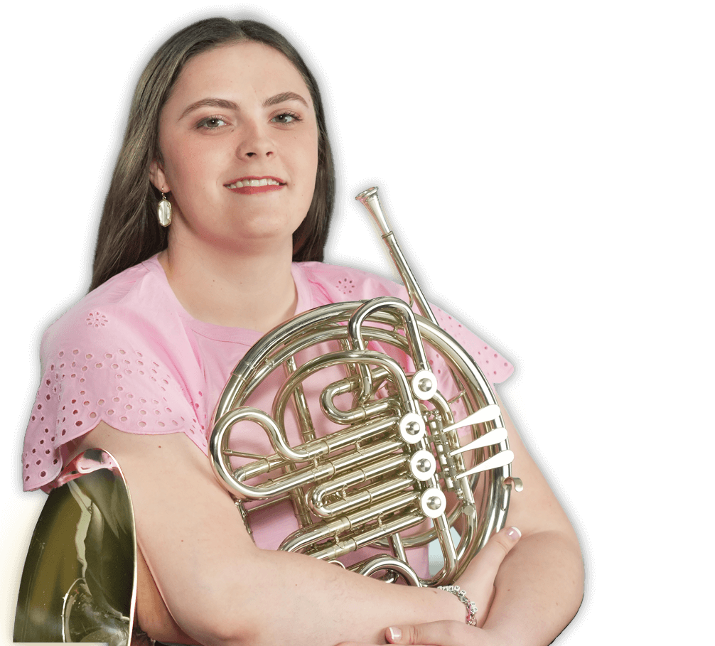 Photo of Alexandra with a french horn